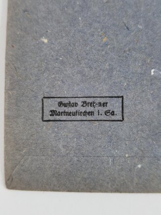 Verleihungstüte zum Eisernen Kreuz 2. Klasse1939 mit Herstellerstempel " Gustav Brehmer Markneukirchen i. Sa. dazu das Verleihungsband, Tüte vorne verblichen