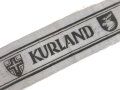 Ärmelband " Kurland " gedruckte Ausführung, rückseitig mit Stempel " Erich Märker, Gallenberg "( nach Auskunft des Vorbesitzers war dies der beliehene)  Länge 23 cm