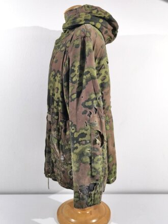 Waffen SS Winterwendejacke. Getragenes Stück mit vielen, zum Teil auch neuzeitlichen Reparaturstellen.