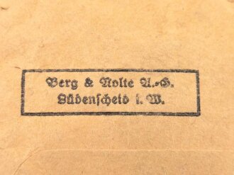 Kriegsverdienstkreuz 2. Klasse 1939 mit Schwertern, im Bandring Hersteller " 40" Berg & Nolte, Lüdenscheid (B&NL)  mit passender Verleihungstüte diese Rückseitig gestempelt