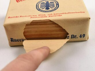 Umverpackung für "Deutsche Markenbutter" Ordentlich um ein passendes Stück Holz gefaltet