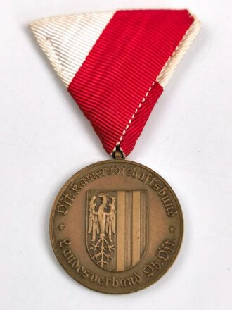 Österreich, Tragbare Medaille " Kameradschaftsbund Landesverband Oberösterreich 25 Jahre Mitglied " in Bronze, an Dreiecksband, mit Kleberesten