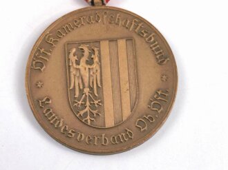 Österreich, Tragbare Medaille " Kameradschaftsbund Landesverband Oberösterreich 25 Jahre Mitglied " in Bronze, an Dreiecksband, mit Kleberesten