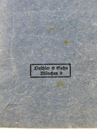 Ehrenkreuz der Deutschen Mutter (Mutterkreuz) in Silber am Band mit Verleihungstüte, Hersteller Deschler & Sohn, München, am rechten unteren Kreuzbereich mit Emailleschäden