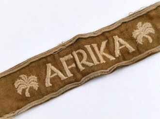 Ärmelband " Afrika " in Kamelhaarausführung, Länge circa 21 cm, guter Zustand