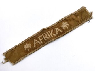 Ärmelband " Afrika " in Kamelhaarausführung, Länge circa 21 cm, guter Zustand