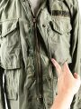 U.S.  M65 field jacket. Used, no label, size Medium. Insignia original sewn