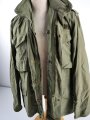 U.S.  M65 field jacket. Used, no label, size Medium. Insignia original sewn