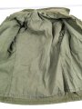 U.S.  M65 field jacket. Used, no label, size Medium. Insignia original sewn