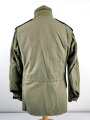 U.S.  M65 field jacket. Used, no label, size Medium. Insignia original sewn