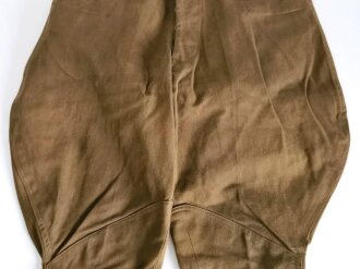 U.S. WWI AEF trousers with " Mills " service belt, legs shortened, otherwise in good condition