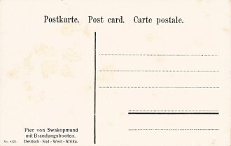 Postkarte, Deutsch Südwestafrika "Pier von Swakopmund mit Brandungsbooten", in den Ecken Abdrücke aus Album