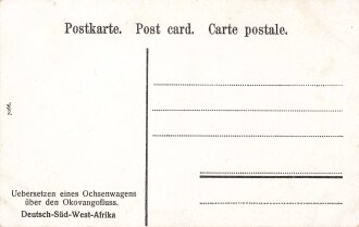 Postkarte, Deutsch Südwestafrika "Uebersetzen eins Ochsenwagens über den Okovangofluss", in den Ecken Abdrücke aus Album