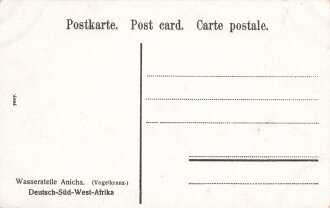 Postkarte, Deutsch Südwestafrika "Wasserstelle Anicha. (Vogelkranz.)", in den Ecken Abdrücke aus Album