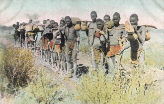 Postkarte, Deutsch Südwestafrika "Ovamboneger auf der Reise", in den Ecken Abdrücke aus Album, defekt