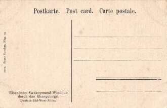 Postkarte, Deutsch Südwestafrika "Eisenbahn Swakopmund-Windhuk durch das Khangebirge", in den Ecken Abdrücke aus Album