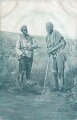 Postkarte, Deutsch Südwestafrika "Eingeborener Soldat (Bastard) mit gefangenem Herero", in den Ecken Abdrücke aus Album