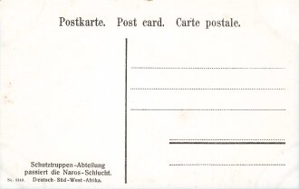 Postkarte, Deutsch Südwestafrika "Schutztruppen-Abteilung passiert die Naros-Schlucht", in den Ecken Abdrücke aus Album