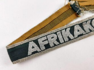 Ärmelband " Afrikakorps" für Angehörige des Heeres. Leicht getragenes, von der Uniform abgetrenntes Stück, Länge 39cm