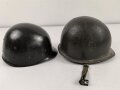 U.S. Army WWII Stahlhelm. Nach dem Krieg bei der U.S. Armee weitergetragen und im Zuge dessen mit frischem Lack, Schweißleder und vermutlich neuerem Kinnriemen versehen. Ungereinigt