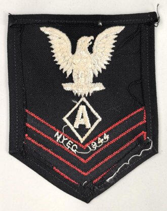 U.S. Navy rating arm badge " A" on dark blue backing