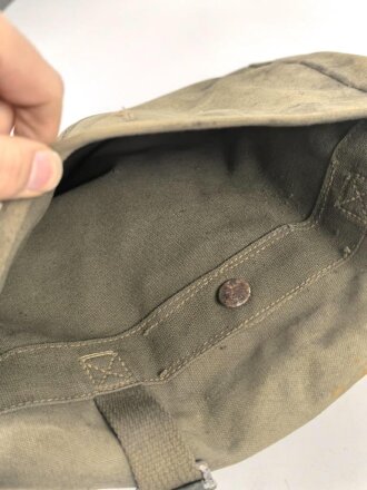 U.S. Army , 1944 dated mussette bag, uncleaned, including a strap and googles