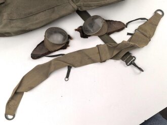 U.S. Army , 1944 dated mussette bag, uncleaned, including a strap and googles