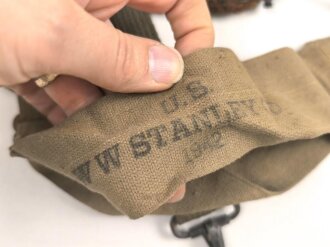 U.S. Army , 1944 dated mussette bag, uncleaned, including a strap and googles