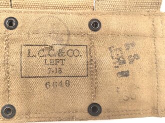 U.S. Army , 1918 dated Cartridge belt M-1910. Field modified, one pocket cut down, used, good condition