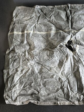 U.S. Army poncho, soft, unreadable markings. White Takum is easy to remove