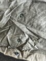 U.S. Army poncho, soft, unreadable markings. White Takum is easy to remove