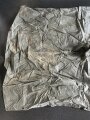 U.S. Army poncho, soft, unreadable markings. White Takum is easy to remove