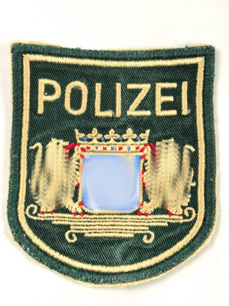 Ärmelabzeichen " Polizei Bayern " dünne Ausführung, aus einem Hemdärmel ausgeschnitten