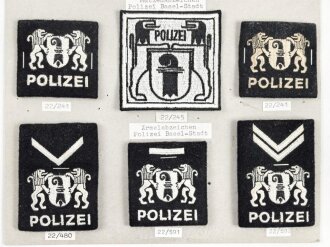 Schweiz, Sammlung Rangabzeichen und Mützenabzeichen der Polizei, auf Karton getackert