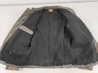 Kriegsmarine, graue Lederjacke mit Etikett der " Hela Berufsbekleidung Kiel". Stark getragenes Stück , ungereinigt