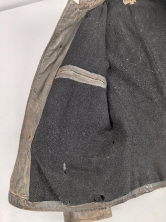 Kriegsmarine, graue Lederjacke mit Etikett der " Hela Berufsbekleidung Kiel". Stark getragenes Stück , ungereinigt